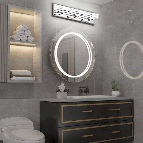 3 Light LED Vanity Light Fixtures With Up And Down Rotatable Heads In Chrome Stainless Steel And Acrylic Finish over bathroom mirror.