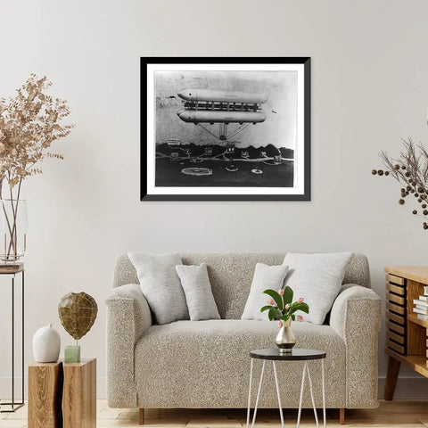 Vintage Airship Toy Model Wall Art Framed Black Wood Print in living room with beige couch and decor, museum quality archival paper.