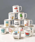 Stacked ceramic mugs with colorful summer-themed designs. Each mug features different illustrations like fruit and plants.