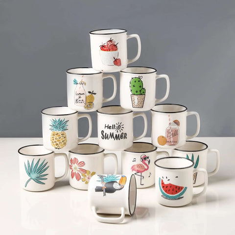 Stacked ceramic mugs with colorful summer-themed designs. Each mug features different illustrations like fruit and plants.