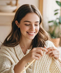 Person knitting with Three Different Sized Nalbinding Needle Set For Knitting And Crochet Large Wooden Bamboo Yarn Needles.