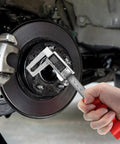 Hand using High Precision Digital Caliper For 0 To 6 Inch (0-150 MM) Stainless Steel With Large LCD Display on brake disc