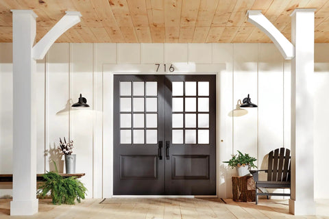 Allenbury 12 Inch One Light Outdoor Wall Light With Textured Black Finish mounted beside double doors on porch