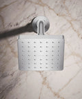 Overhead view of Parallel SF 1.75 GPM Showerhead In Polished Chrome Single Function Water Saving Performance Slick Modern Look With Circular Inset Square Design For A Sleek Bathroom Upgrade mounted on marble wall.