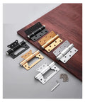 Two Pack Aluminum Alloy Hidden Door Closer Hinges With Soft Close For No Slam, Quiet, Smooth Doors, Gold and Silver hinges on table