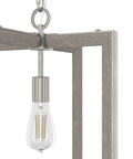 Close-up of Woodburn One Light Pendant Light in brushed nickel, rectangle fixture with E26 bulb for clean modern home vibe.