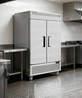 Straight Up Heavy Duty Kitchen Workhorse 54 Inch Commercial Upright Freezer Boasting 49 Cubic Feet Of Reliable Frost Free Storage With Eight Adjustable Shelves in a stainless steel kitchen.