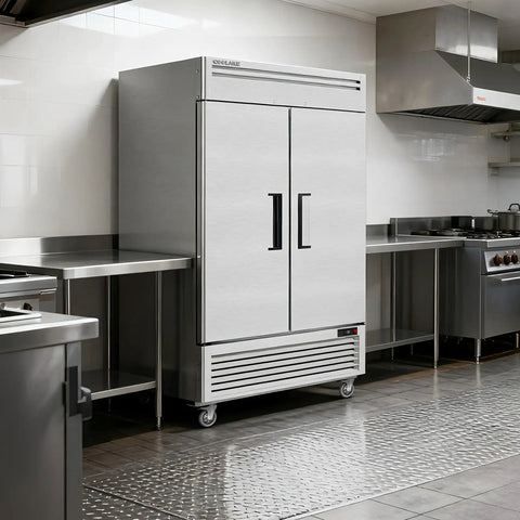 Straight Up Heavy Duty Kitchen Workhorse 54 Inch Commercial Upright Freezer Boasting 49 Cubic Feet Of Reliable Frost Free Storage With Eight Adjustable Shelves in a stainless steel kitchen.