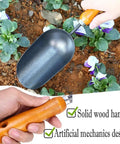 Hand holding 12.6-Inch Garden Hand Trowel With Wooden Handle And Rust-Resistant Steel Head For Transplanting Flowers