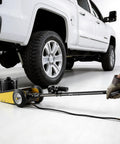 22 Ton Workhorse Air Hydraulic Floor Jack For SUVs And Trucks Heavy Duty Steel Pneumatic Lift With Quick Lift Pump Extension Posts And Rugged Racing Style Design For Easy Lifts And Heavy Vehicle Service under white truck