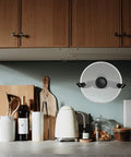 Traceless Wall Mounted Pot Lid Rack Organizer Durable PP Plastic No Drill Installation in kitchen with black lid holder