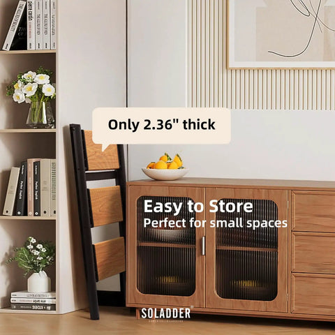 Three Step Ladder With Anti Slip Pedals, Folding Step Stool In Black And Woodgrain, Lightweight Aluminum Frame, Non Slip Feet For Stable Climb, Easy Open Fold, Built To Last For Home, Garage, And DIY Projects. Folded beside cabinet, 2.36-inch thick