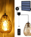 Lit Solar Pendant Lights With Amber Hammered Glass Shade And Edison Bulb Vibe featuring textured amber glass and solar panel