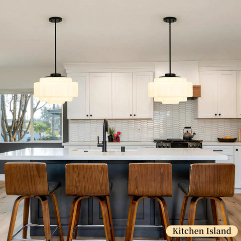 puncoll Vintage Black Milk Glass Pendant Light, 15.7'' White Chandelier hanging above a modern kitchen island with bar stools.