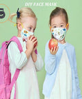 Two children with face masks holding apples, featuring DIY face mask with black plastic toggle stopper in the corner.