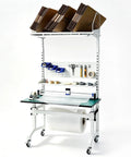 Solid Ecommerce Packing Table And Mobile Shipping Station With Built In Power And Led Lights, Ergonomic Standing Workbench Featuring Esd Safe Surface, Tape Dispenser, Storage Shelves, Built Tough Frame, Smooth Rolling Wheels, 1400 Lb Capacity with bubble wrap and tools.