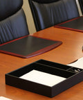 Classic Black Leather Conference Room Organizer Tray for Executive Desks and Boardrooms on a wooden table