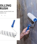 Lightweight Small Paint Roller With Ergonomic Handle For Fast Wall Coverage And Crisp Clean Edges Ideal For Ceilings Trim And Furniture Zero Drip Formula Makes Every Painting Job A Total Breeze in use against a textured wall.