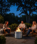 Smokeless Firepit Bonfire 20 Inch Outdoor Stainless Steel Stove Portable with Carry Bag for Camping Patio Backyard Easy Setup and Cleaning 360 Degree Airflow for Cozy Warmth and Real Outdoor Vibes with friends on patio at dusk
