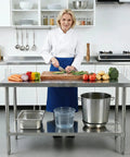 Stainless Steel Workbench With Dual Tier Storage Rack, 31.5 By 20 Inches, Heavy Duty Prep Table in a kitchen setting with vegetables.