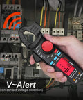 Hand holding Mini Clamp Meter For AC And DC Current Up To 100 Amp, Auto Range Digital Multimeter with Frequency Tester, front view