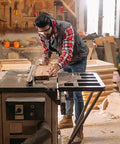 Woodworker using Pro Grade Aluminum Miter Track Jigs T Slot Guide for woodworking on table saw in workshop.