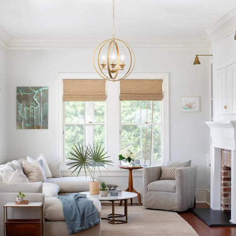 Gold Orb Chandelier Pendant Light Three Light Globe Fixture Modern Luxury Dining Room Foyer Kitchen Bedroom With Adjustable Height Openwork Metal Spheres For A Luxe Glam Vibe in a cozy living room setting