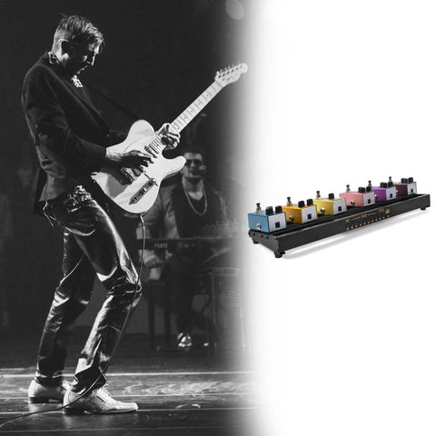 Gig-Ready Aluminum Guitar Pedalboard With Built-In Power Supply next to guitarist performing on stage, showcasing portable setup.