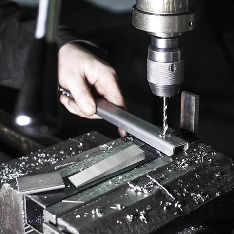 Person using drill press with Eight Piece Metal Wedge Shims Triangle Flange Wedge Set for welding and pipe fittings in workshop