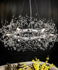 Modern Crystal Firework Chandelier Pendant Light In Chrome Silver Finish above a sofa, round with crystal details and luxe sparkle.