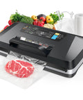 Powerful 95Kpa Automatic Food Vacuum Sealer with Built In Cutter and Bag Storage sealing a bag of meat, surrounded by vegetables