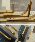 Heavy Duty Shelf Brackets Wall Mount Kickass Brass Metal Supports in various angles on a wood surface.