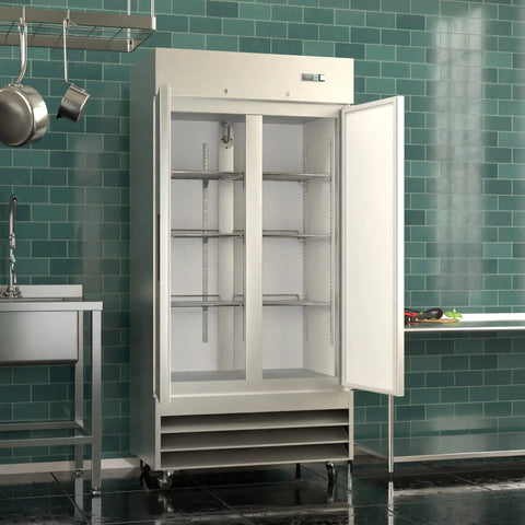 Built Tough Two Door Reach In Commercial Freezer 27 6 Cubic Feet Stainless Steel Kitchen Workhorse with doors open showing shelves.