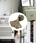Ginkgo Leaf Knob Handles Six Pack Antique Brushed Bronze Pendant Pulls for cabinets and closets shown on furniture