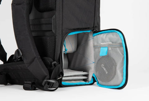 Open rear compartment of City Commuter Camera Backpack With 18 Liter Rolltop Closure, showing padded camera and gadget storage