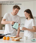 Couple pouring hot water from mint green 0.9L Electric Kettle With 304 Stainless Steel Interior, 1000W Fast Boil In 4 To 6 Minutes