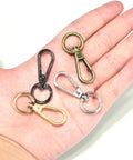 Heavy Duty Swivel Lobster Clasp Half Inch Zinc Alloy Hook For Purses Bags Lanyards Keys 12 Pack Gunmetal Black Finish in hand.