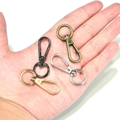 Heavy Duty Swivel Lobster Clasp Half Inch Zinc Alloy Hook For Purses Bags Lanyards Keys 12 Pack Gunmetal Black Finish in hand.