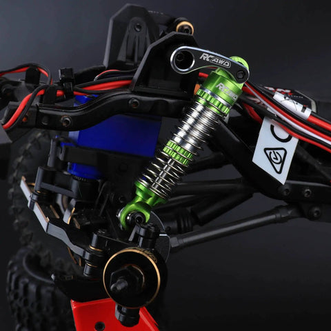 Close-up of green Lengthened Fifty Nine Millimeter Aluminum Oil Filled RC Shock Absorber Upgrade installed on an RC car.