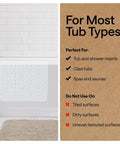 Premium Non Slip Bath Mat With Power Traction Suction Cups That Stay Locked For Stable Bathtub Floor Liner Featuring Rapid Moisture Escape Panels And No Fuss Cleanup Style In Crisp White Dimension Thirty Five By Sixteen displayed on tub.