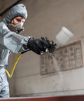 Mini HVLP Spray Gun With Precision Nozzles For Auto Touch Up Painting And Detailing in use by a masked individual.