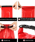 Red waterproof roll-top first aid kit bag with black buckle straps.