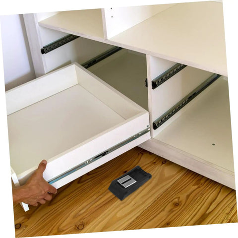 Two Pack Rubber Toggle Latch Clamps For Secure Storage And Quiet Draw Latches next to a white cabinet drawer on wooden floor