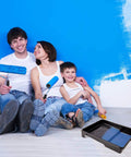 Family using DIY Ready 17 Piece Paint Roller Kit With 9 Inch And 4 Inch Rollers for wall painting, trays visible on floor