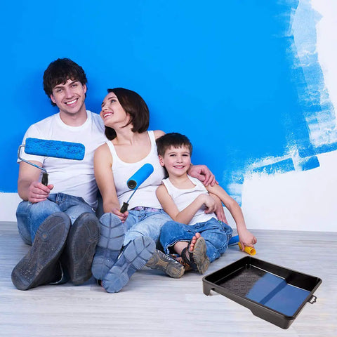 Family using DIY Ready 17 Piece Paint Roller Kit With 9 Inch And 4 Inch Rollers for wall painting, trays visible on floor
