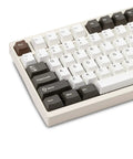 Badass Cnc Aluminum Mechanical Keyboard Featuring Smooth Triple Mode Wireless Connectivity Quick Release Design And Dope Hot Swap Pbt Keycaps top view with PBT keycaps in white and dark brown.