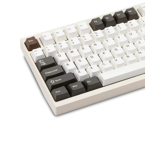 Badass Cnc Aluminum Mechanical Keyboard Featuring Smooth Triple Mode Wireless Connectivity Quick Release Design And Dope Hot Swap Pbt Keycaps top view with PBT keycaps in white and dark brown.