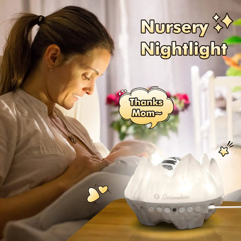 Mother with baby, using 4 In 1 Northern Lights Aurora Projector With Bluetooth Speaker And White Noise Machine for nursery decor.