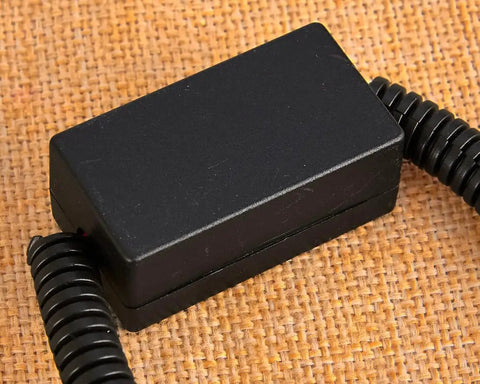 Solid VCM Bypass Harness And Resistor Plug Set For 3.5L V6 Engine with connected wires on textured background.