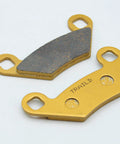 Ceramic brake pads for Polaris Sportsman ATV, two pieces; close-up view shows gold backing plates and dark friction material